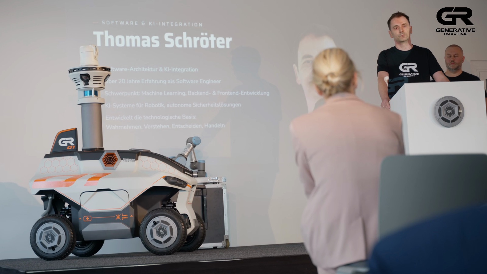 GR-01 on stage at the press conference at security essen 2026, the lectern on the right